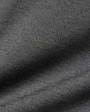 Psycho Bunny MENS JOJI PERFORMANCE POLO in a deep charcoal grey, featuring a premium, subtly textured pique knit fabric, offering a refined streetwear aesthetic and classic fit.