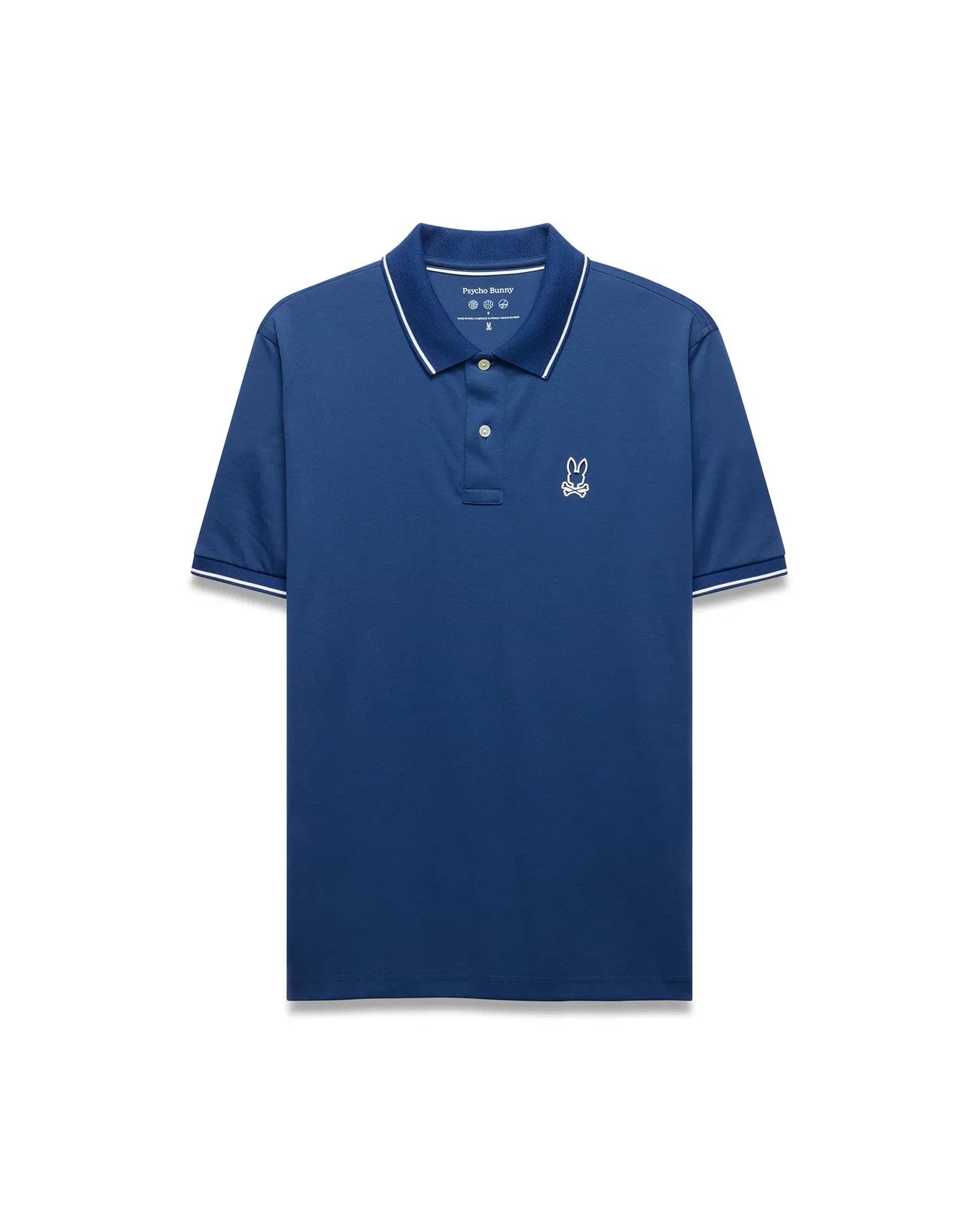 Mens Joji Performance Polo, a deep blue classic fit polo with a smooth performance fabric, features a white embroidered Psycho Bunny skull logo on the left chest and white tipping on the collar and cuffs. (5)