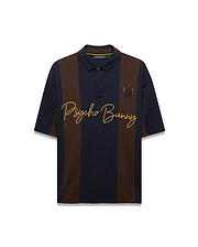 Mens Chad Relaxed Fit Striped Polo in navy and brown vertical stripes, featuring a relaxed fit, smooth jersey knit, large yellow embroidered Psycho Bunny script, and small embroidered skull logo. (5)