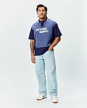 Mens Kelly Oversized Polo, a two-tone blue color block jersey polo with an oversized fit, featuring white collar stripes and a large white PSYCHO BUNNY text logo across the chest. (4)