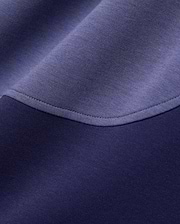 Mens Kelly Oversized Polo in dark navy and periwinkle blue color-block pique knit fabric, featuring a curved seam with visible stitching. (6)