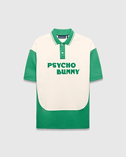 Mens Kelly Oversized Polo, cream and green color block smooth knit with large green PSYCHO BUNNY text on chest, ribbed collar with white stripes, and small embroidered bunny skull.