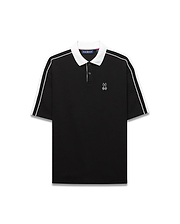 Mens Ceano Relaxed Fit Heavy Pique Polo in black with a crisp white collar, white double-stripe sleeves, and a small embroidered white Psycho Bunny skull logo on the left chest.