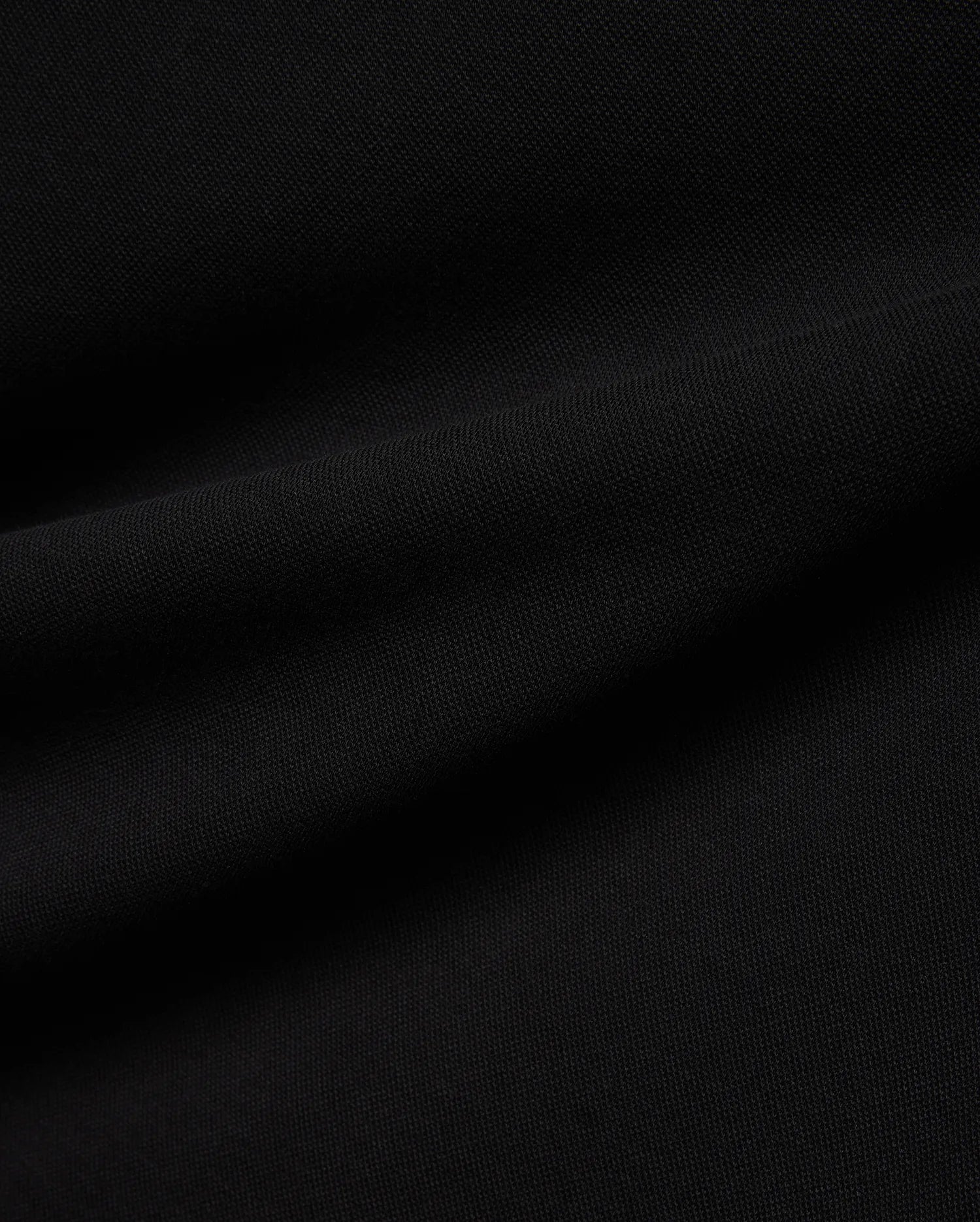 Psycho Bunny Mens Ceano Relaxed Fit Heavy Pique Polo in deep black, crafted from premium textured heavy pique fabric, typically featuring the iconic embroidered bunny skull logo on the chest.