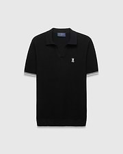 Black Mens Selby Knit Polo featuring a textured knit, classic fit, v-neck collar, and ribbed cuffs with white and cream double stripes. A small white embroidered Psycho Bunny skull logo adorns the left chest. (4)
