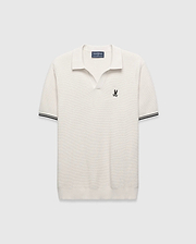Cream Mens Selby Knit Polo featuring a unique textured knit fabric, open collar, small black embroidered Psycho Bunny skull logo on the left chest, and ribbed cuffs with black double stripes. (5)
