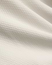 Mens Selby Knit Polo in a light cream hue, showcasing a premium textured knit fabric with a distinctive, subtle wave pattern, embodying refined streetwear style. (6)