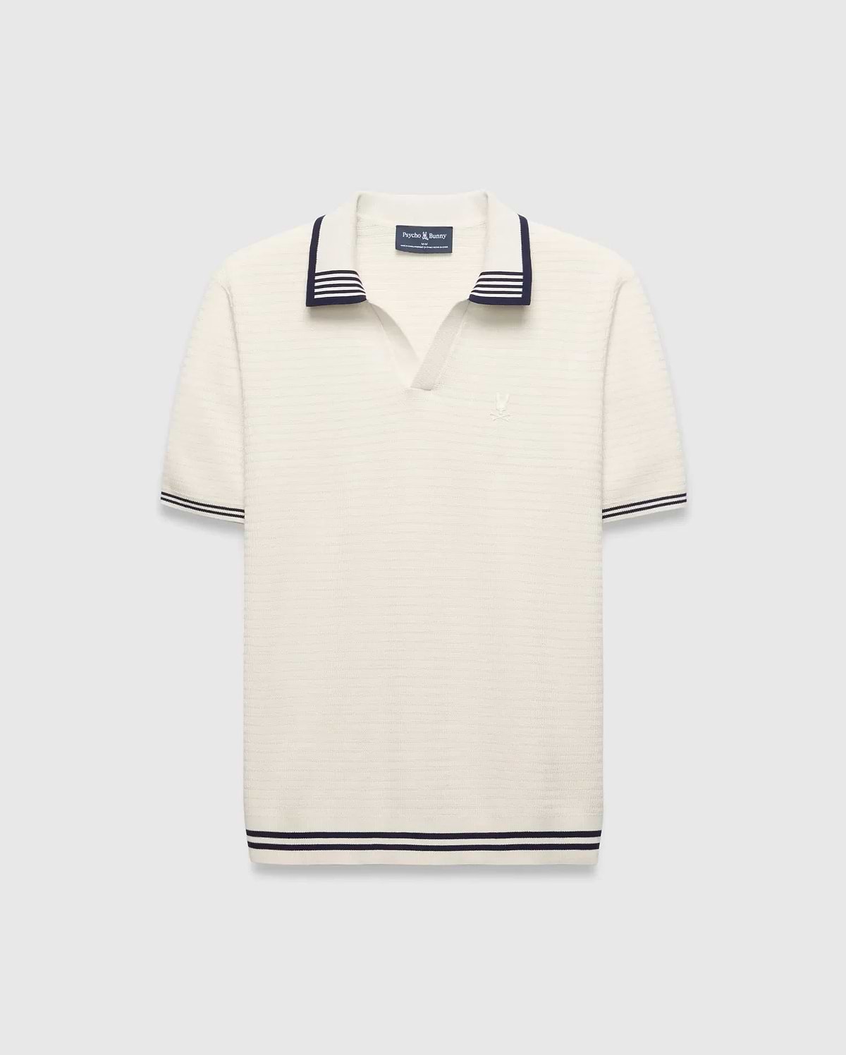 Mens Elowen Knit Polo, cream ribbed knit with navy striped V-neck collar, cuffs, and hem, featuring a small embroidered Psycho Bunny skull logo on the left chest. (4)