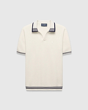 Mens Elowen Knit Polo, cream ribbed knit with navy striped V-neck collar, cuffs, and hem, featuring a small embroidered Psycho Bunny skull logo on the left chest. (4)