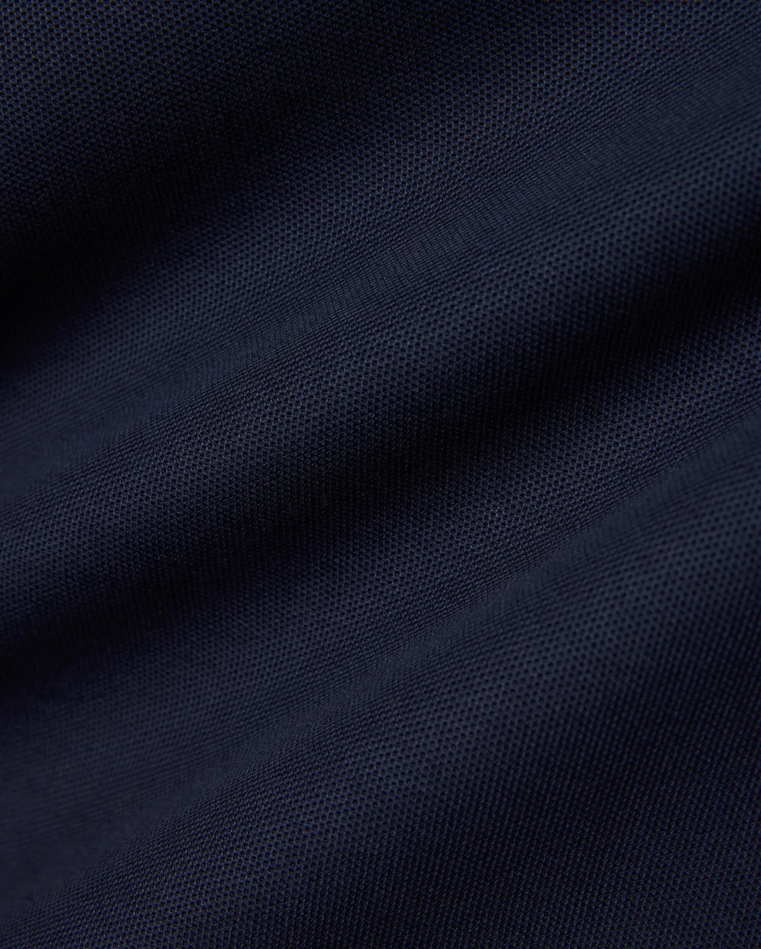Men's Slade Pique Polo in a rich, dark navy blue, highlighting the premium, breathable pique fabric with its distinctive textured weave, perfect for refined streetwear. (6)