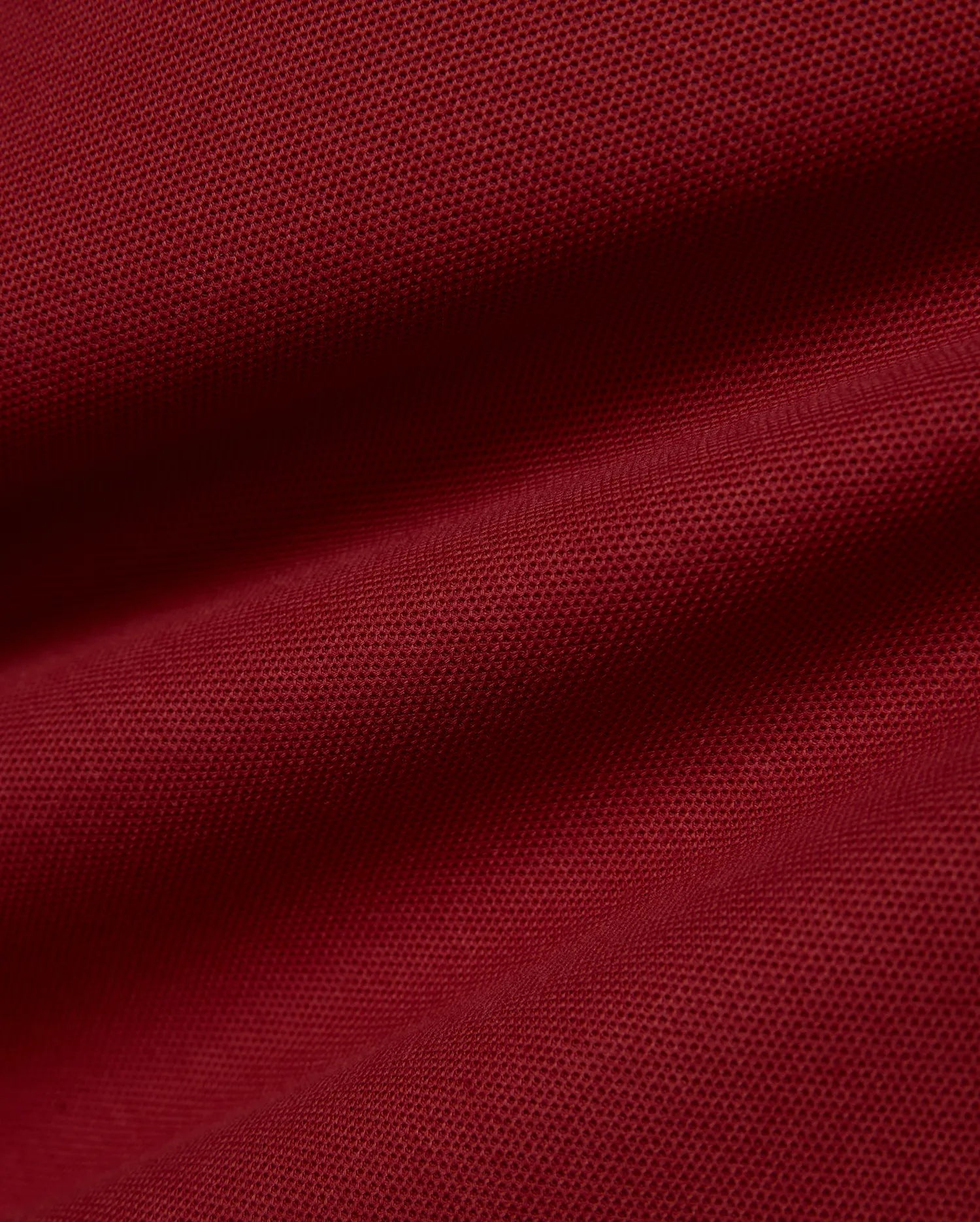 Men's Slade Pique Polo in rich burgundy, featuring a classic fit, breathable pique fabric, and the iconic small embroidered Psycho Bunny skull logo on the left chest. (6)