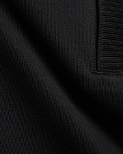 Men's Nolen Oversized Jersey Polo in rich black, highlighting its premium soft jersey knit fabric and a finely ribbed placket detail. (6)