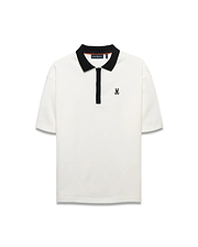 Men's Nolen Oversized Jersey Polo in cream, featuring a black ribbed collar, black placket, and a small black embroidered Psycho Bunny skull logo on the left chest. (5)