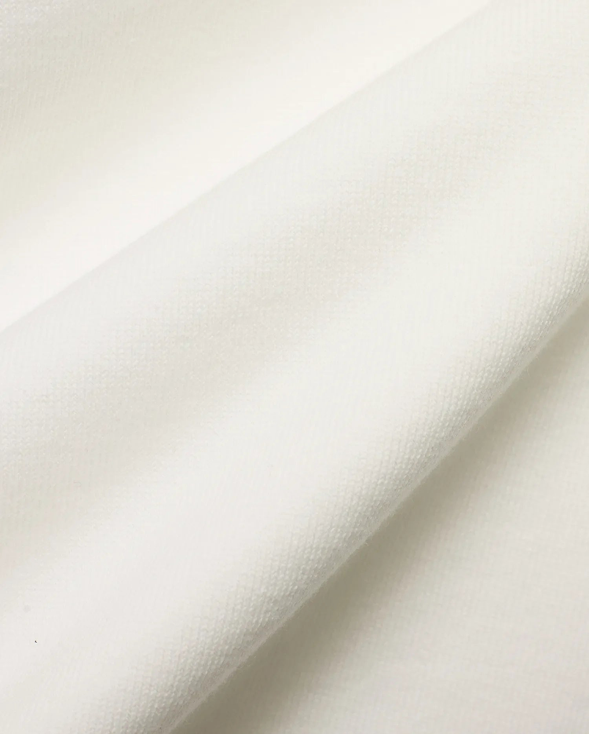 Men's Nolen Oversized Jersey Polo in pristine white, highlighting the luxurious, soft jersey knit fabric with a subtle, refined texture, perfect for premium streetwear. (6)