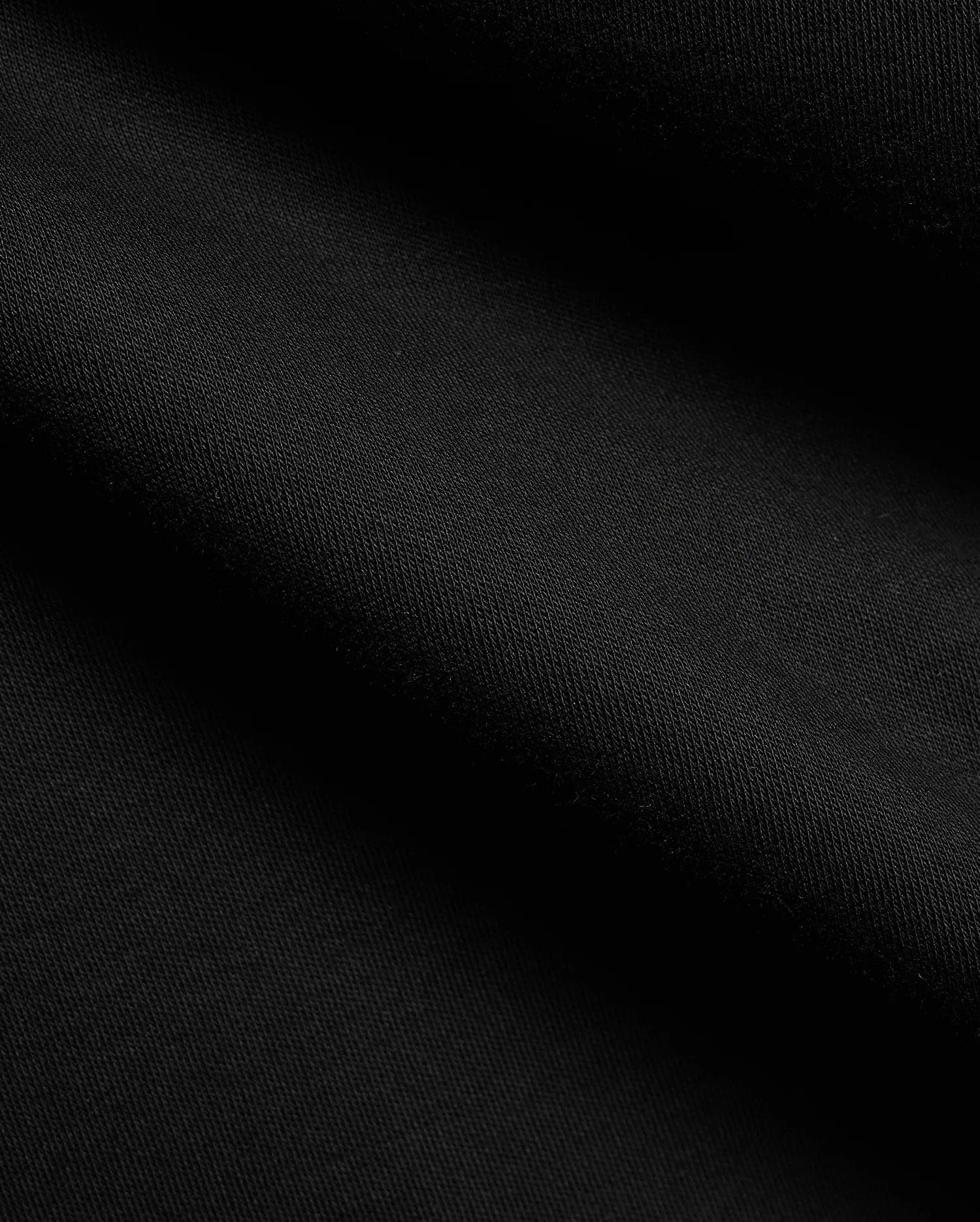 Men's Teddy Johnny Collar Polo, a classic black pique knit with a refined texture, featuring the signature embroidered Psycho Bunny skull logo on the chest for premium streetwear. (6)
