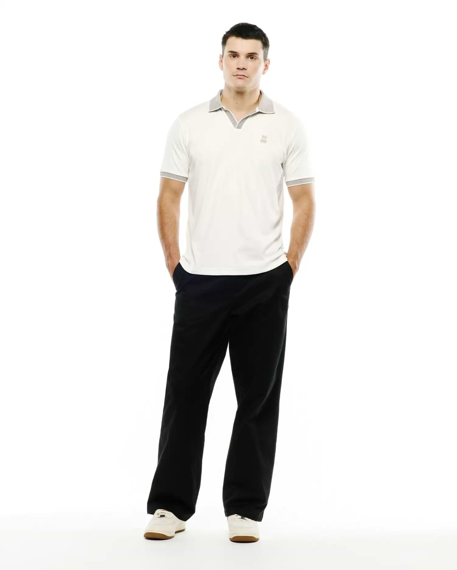 Men's Teddy Johnny Collar Polo, a classic fit off-white jersey polo with a grey patterned Johnny collar and matching sleeve cuffs, featuring a small embroidered Psycho Bunny skull logo on the left chest. (4)