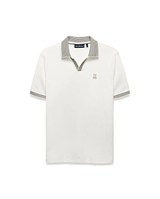 Men's Teddy Johnny Collar Polo, a classic fit white jersey knit polo with a black and white micro-houndstooth Johnny collar and sleeve cuffs, featuring a small embroidered gold Psycho Bunny skull logo on the left chest. (5)