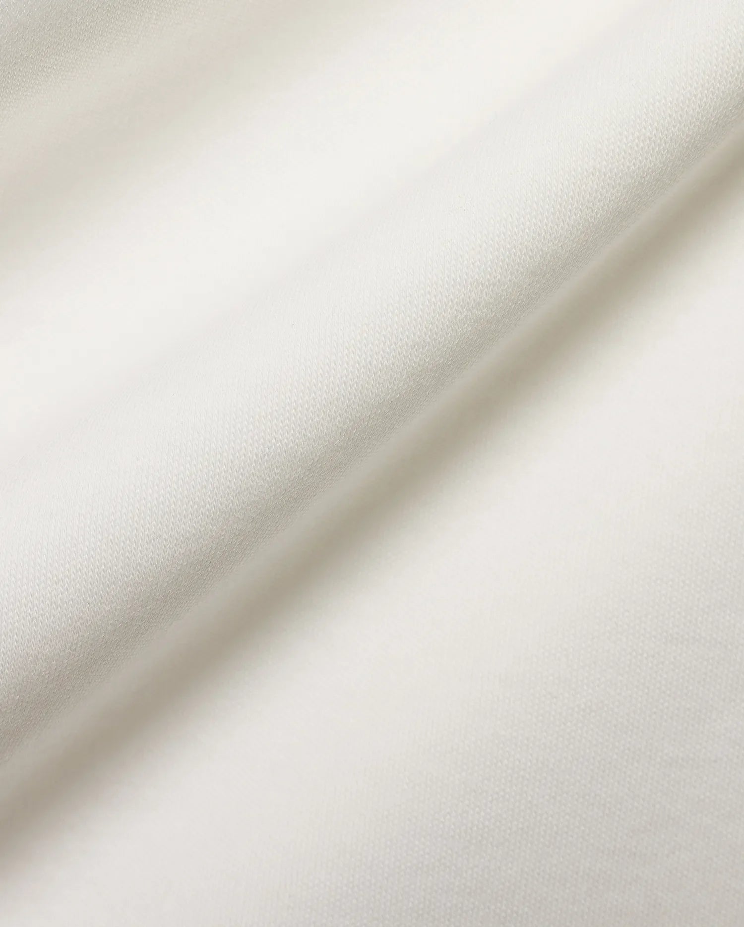 Crisp white pique fabric detail for the premium Psycho Bunny Men's Teddy Johnny Collar Polo, showcasing its refined texture and signature embroidered bunny skull logo. (6)