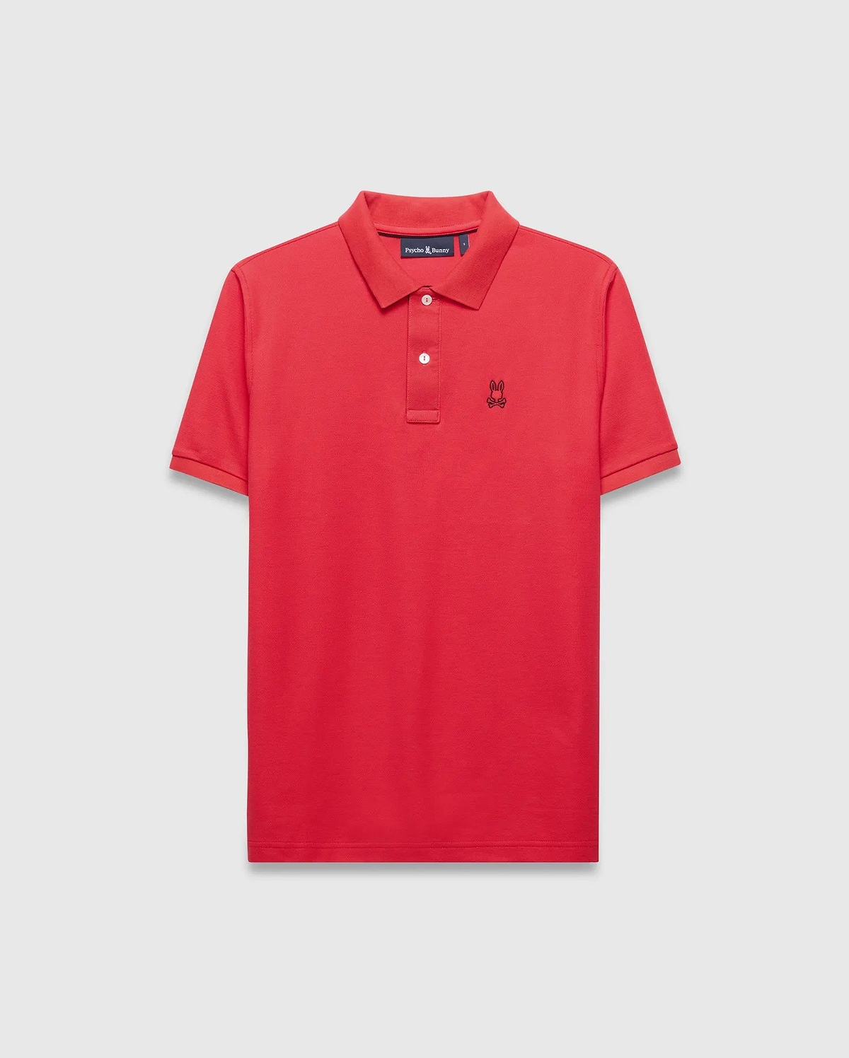 Mens Blythe Pique Polo in vibrant red, featuring a classic fit, pique texture, two-button placket with white buttons, and a small black embroidered Psycho Bunny skull logo on the left chest. (5)