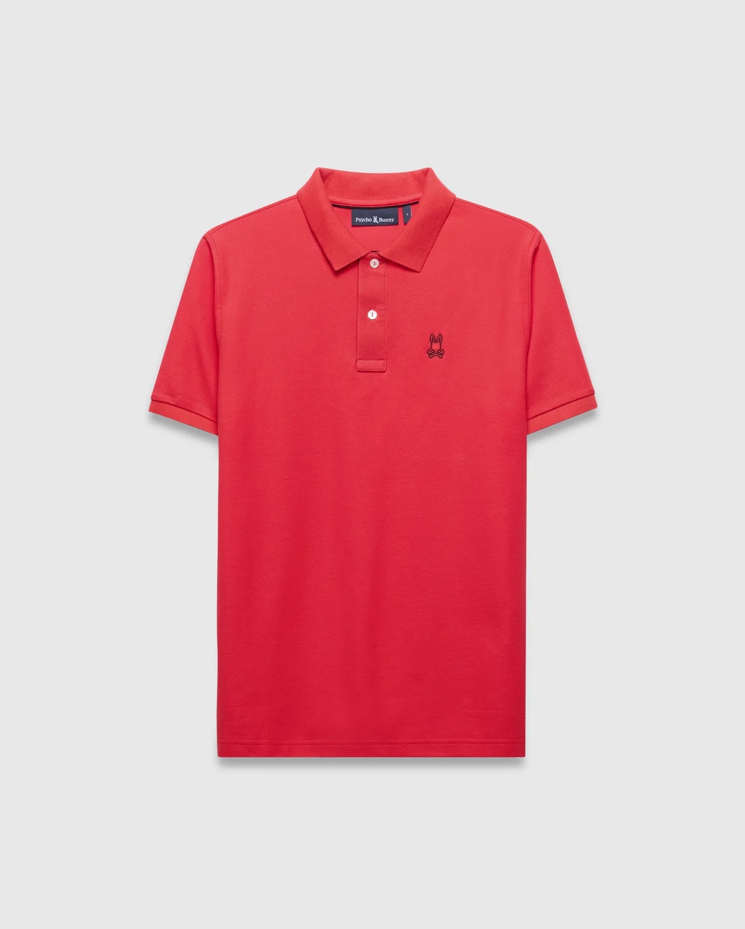 Mens Blythe Pique Polo in vibrant red, featuring a classic fit, pique texture, two-button placket with white buttons, and a small black embroidered Psycho Bunny skull logo on the left chest. (5)