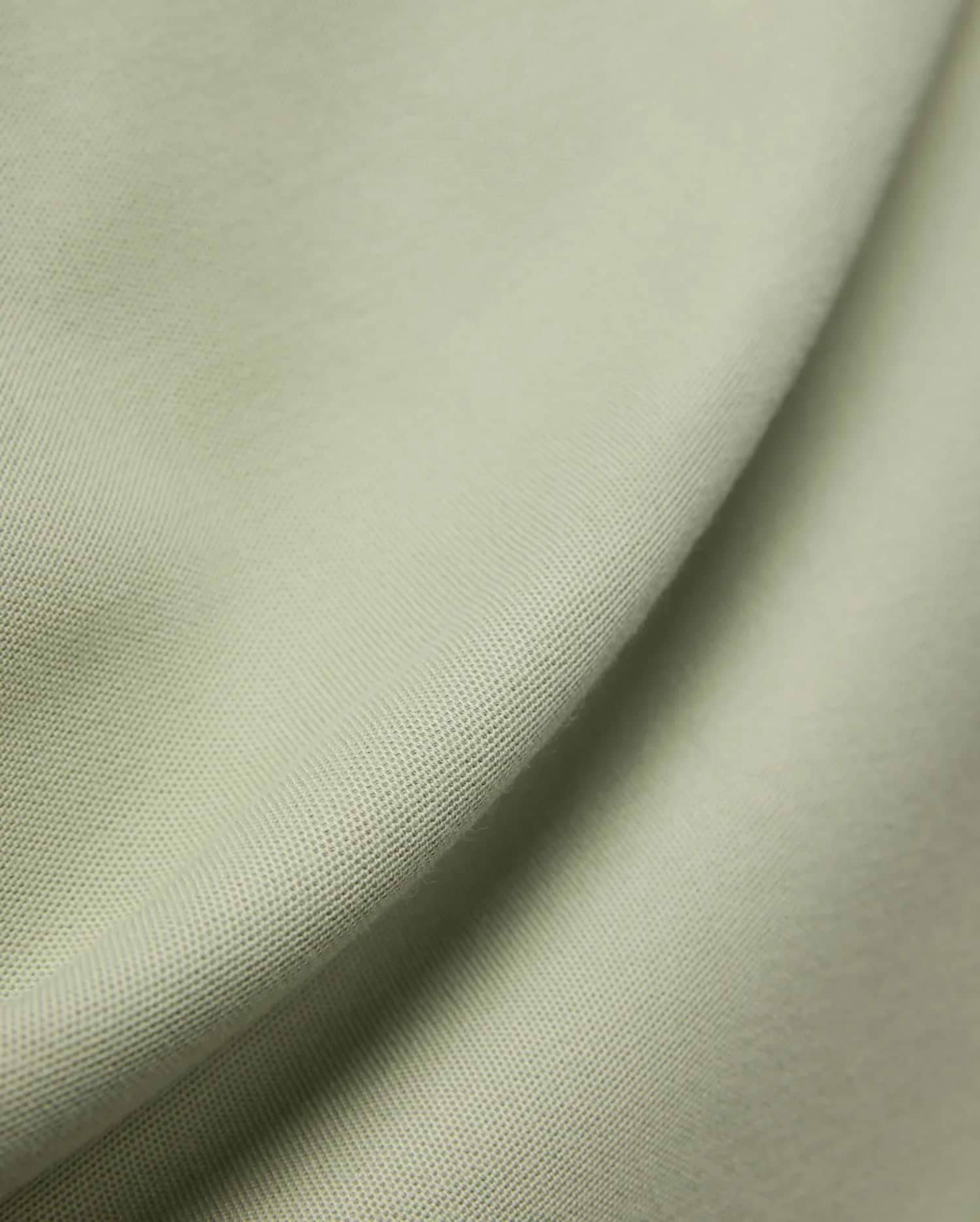 MENS BLYTHE PIQUE POLO, featuring a luxurious, breathable light sage green pique fabric with a distinctive textured weave, reflecting Psycho Bunny's premium menswear quality. (6)