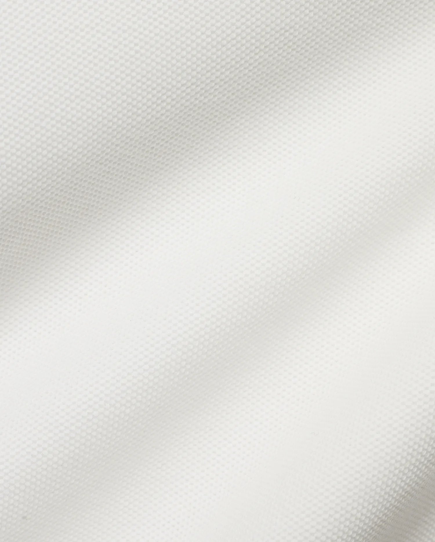 Crisp white Men's Klaus Pique Polo, crafted from premium textured pique fabric, featuring the iconic small embroidered Psycho Bunny skull logo on the left chest for refined streetwear style. (6)
