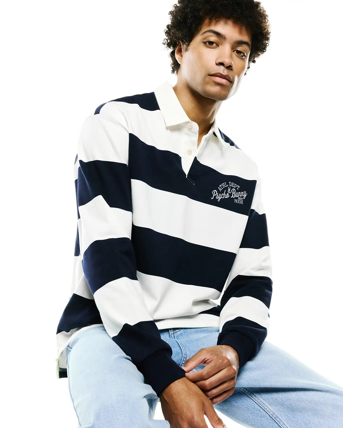 Mens Keven Ls Relaxed Fit Polo in navy and white horizontal stripes, featuring a relaxed fit cotton jersey fabric and an embroidered Athl Dept Psycho Bunny Est. 2005 logo on the left chest.