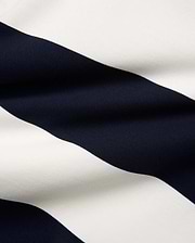 Mens Keven Ls Relaxed Fit Polo crafted from premium pique knit fabric, showcasing wide, crisp navy blue and white horizontal stripes with a distinct, refined texture.