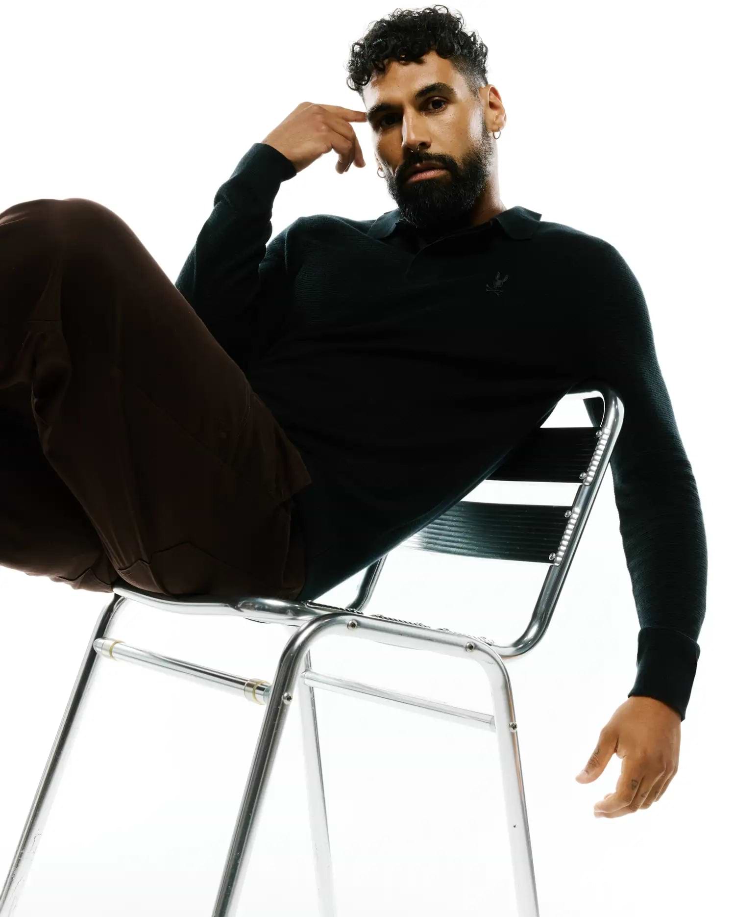 Mens Leroy Long Sleeve Knit Polo in deep forest green, featuring a textured knit, classic fit, and a subtle embroidered Psycho Bunny skull logo on the left chest.