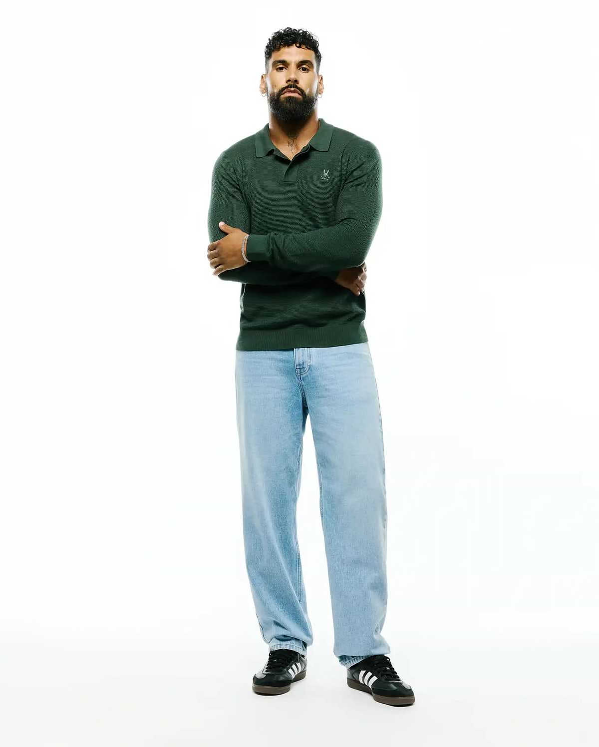 Mens Leroy Long Sleeve Knit Polo in deep forest green, featuring a classic fit, textured knit fabric, and a small white embroidered Psycho Bunny skull logo on the left chest.