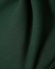 Mens Leroy Long Sleeve Knit Polo in dark green, featuring a prominent ribbed knit texture with subtle fabric folds.