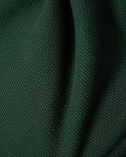 Mens Leroy Long Sleeve Knit Polo in dark green, featuring a prominent ribbed knit texture with subtle fabric folds.