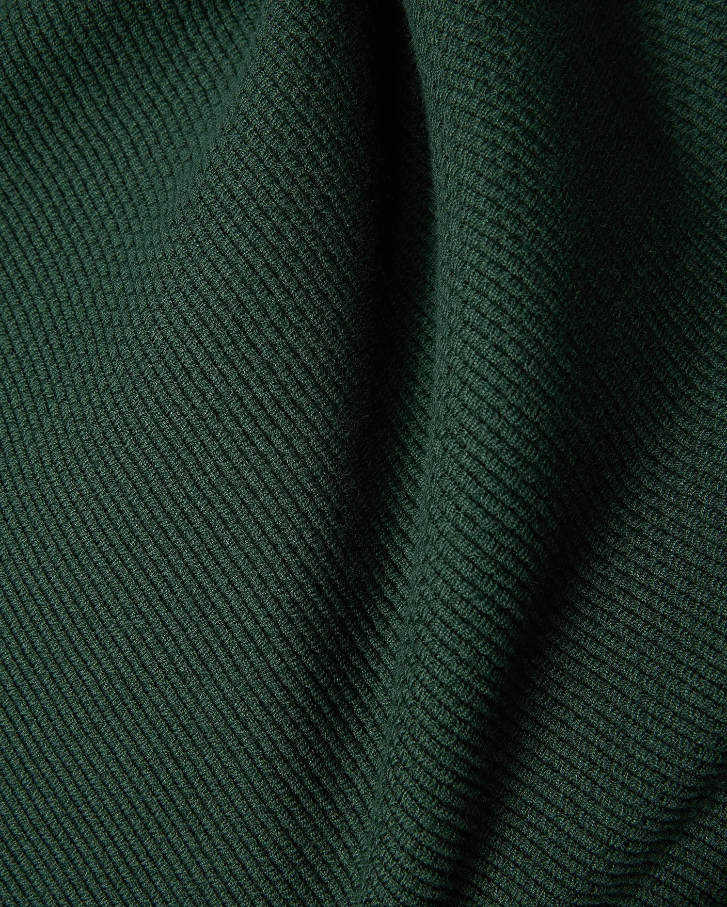 Mens Leroy Long Sleeve Knit Polo in dark green, featuring a prominent ribbed knit texture with subtle fabric folds.