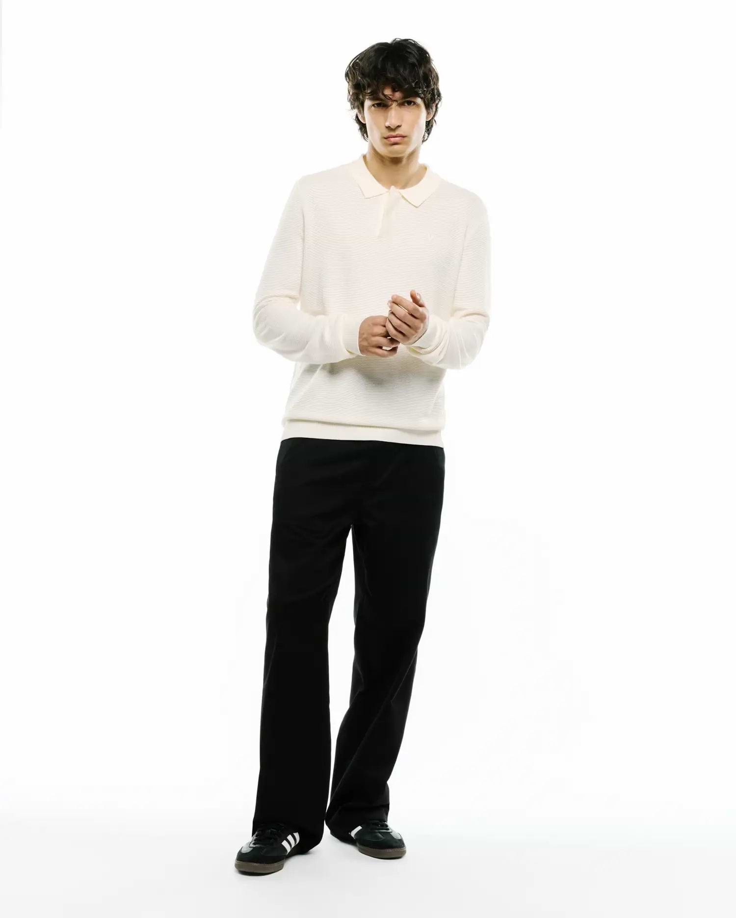 Cream Mens Leroy Long Sleeve Knit Polo with a classic fit, featuring a ribbed texture and a small embroidered Psycho Bunny skull logo on the left chest.
