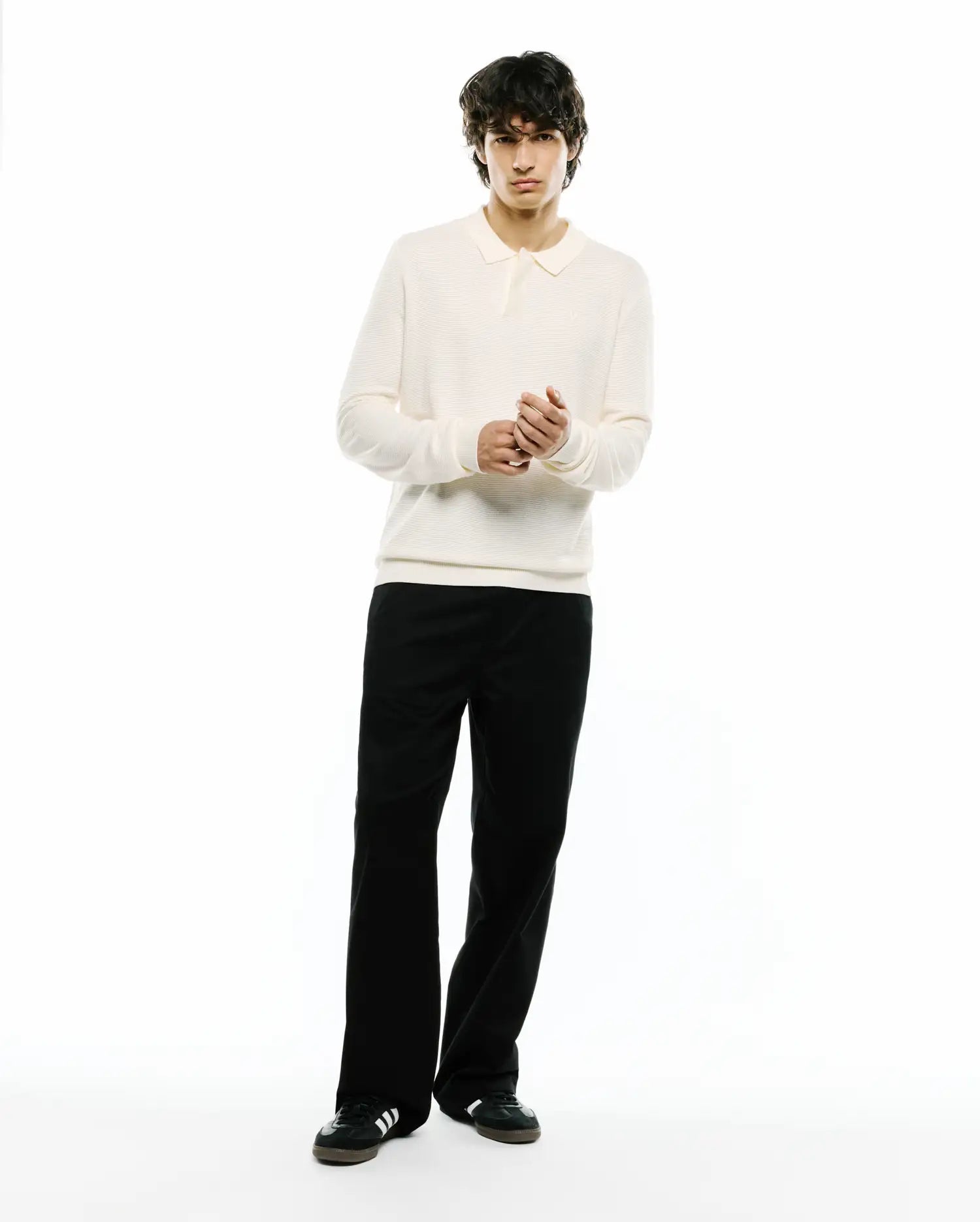 Cream Mens Leroy Long Sleeve Knit Polo with a classic fit, featuring a ribbed texture and a small embroidered Psycho Bunny skull logo on the left chest.