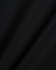 Mens Robin Pique Polo, a premium black pique knit fabric showcasing its distinctive textured weave and subtle drape, embodying Psycho Bunny's refined streetwear quality.
