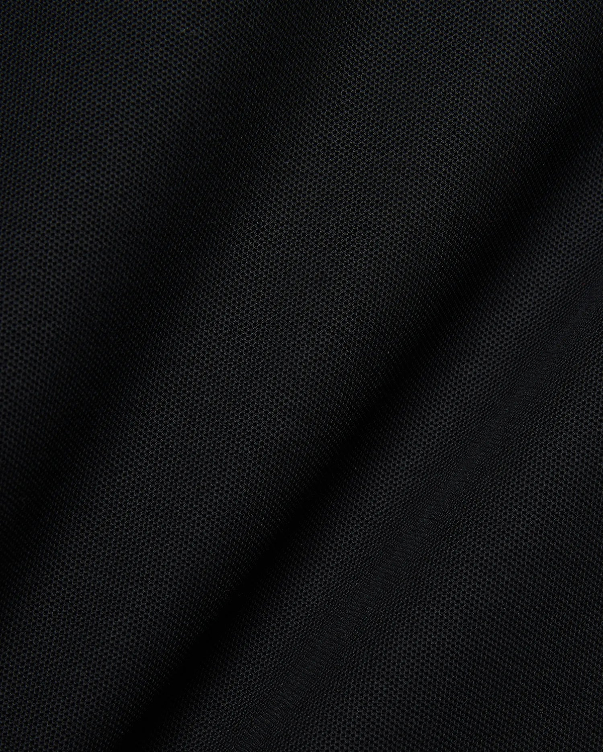 Mens Robin Pique Polo, a premium black pique knit fabric showcasing its distinctive textured weave and subtle drape, embodying Psycho Bunny's refined streetwear quality.