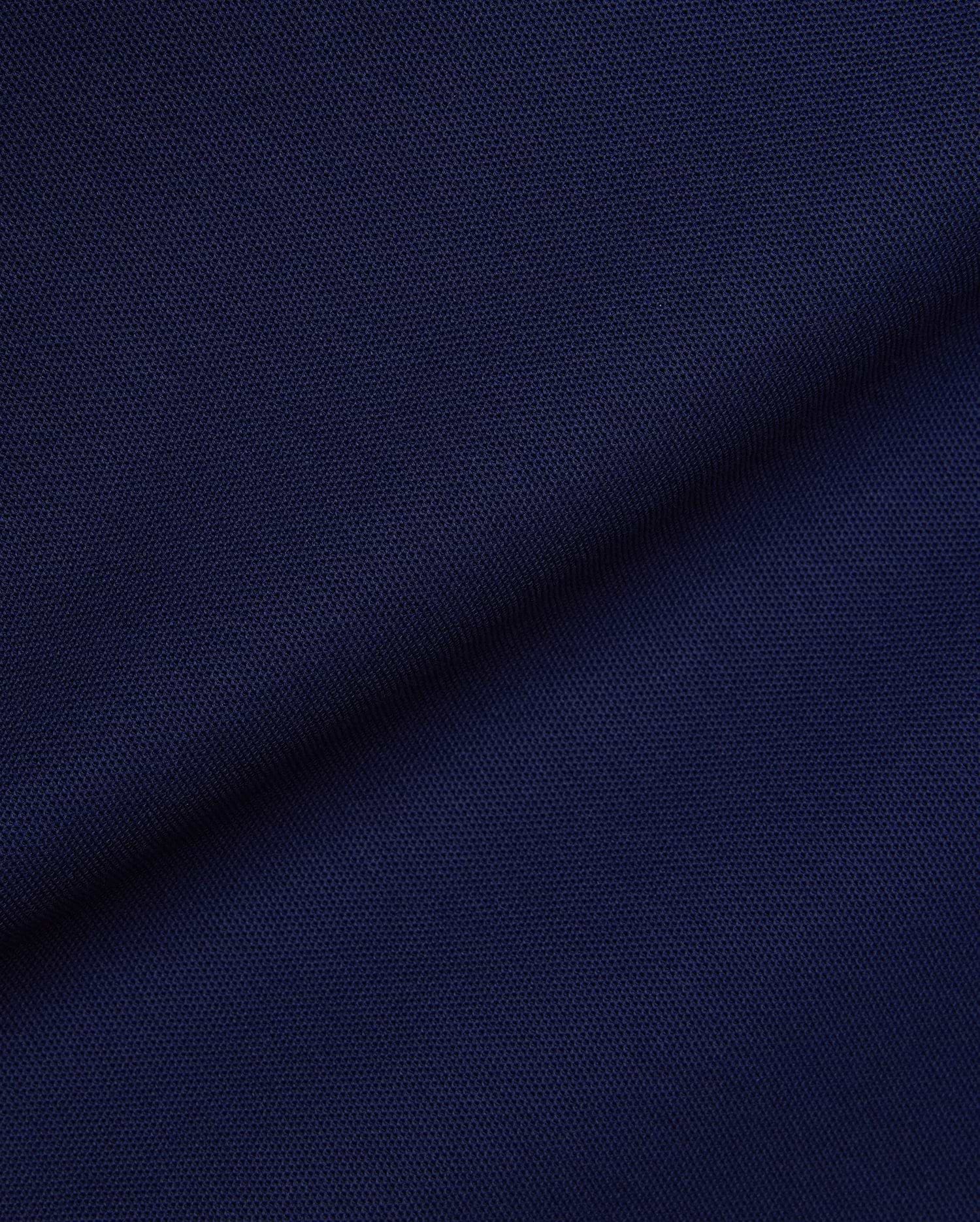Mens Robin Pique Polo in a rich, deep navy blue, showcasing the classic textured pique fabric, a staple of Psycho Bunny's premium, refined streetwear collection.