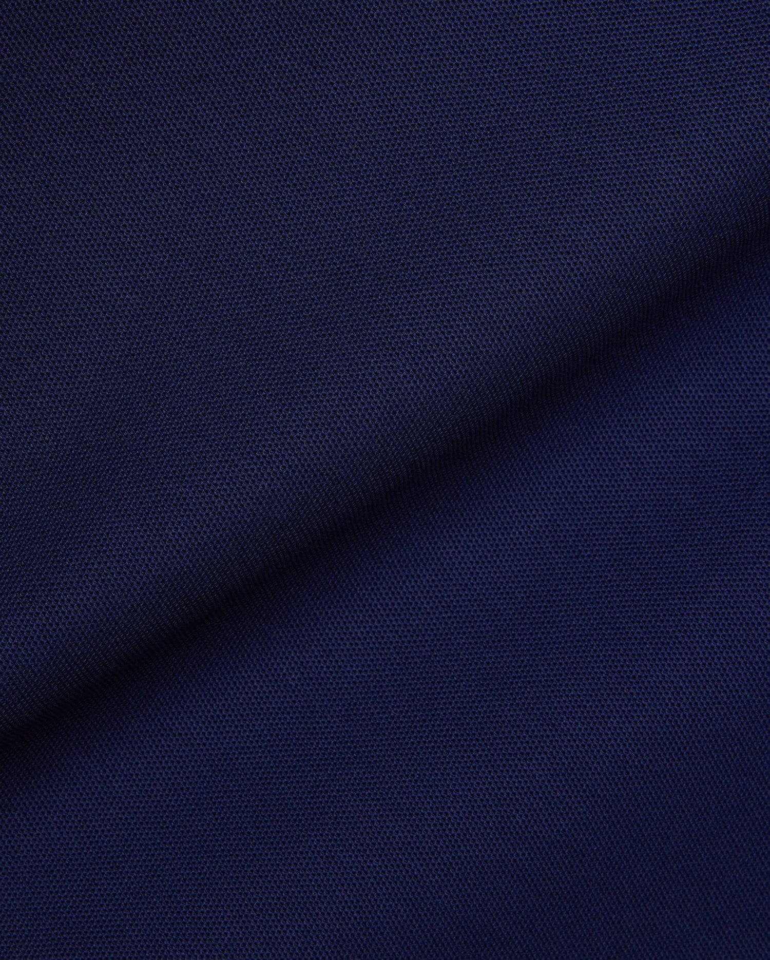 Mens Robin Pique Polo in a rich, deep navy blue, showcasing the classic textured pique fabric, a staple of Psycho Bunny's premium, refined streetwear collection.