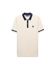 Mens Robin Pique Polo, a classic fit cream pique polo with navy blue ribbed collar, two-button placket, cuffs, and an embroidered Psycho Bunny skull logo on the left chest.