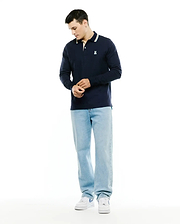 Men's Grover Pique Longsleeve Polo in navy, featuring a classic fit, pique texture, striped collar with cream and light blue, and a small embroidered white Psycho Bunny skull logo on the left chest. (4)