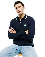 Men's Grover Pique Longsleeve Polo in navy, featuring a classic fit, pique texture, a beige and light blue striped collar, and a small embroidered Psycho Bunny skull logo on the left chest. (3)