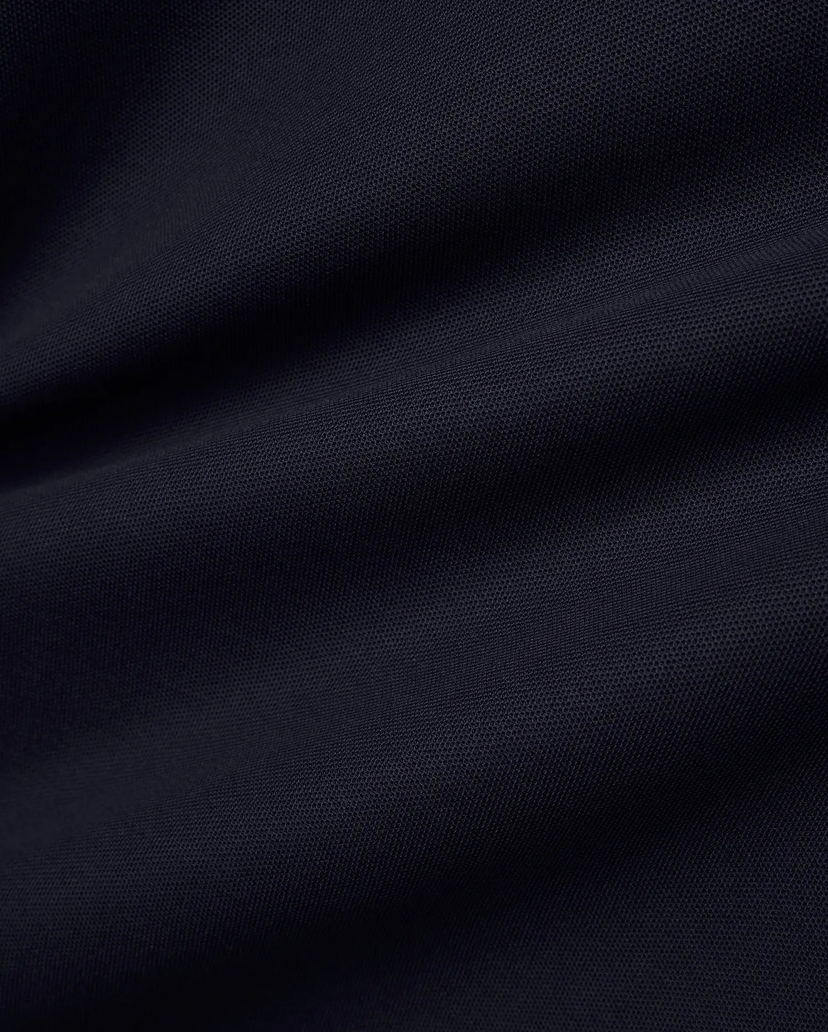 Men's Grover Pique Longsleeve Polo in a deep, luxurious navy blue, showcasing the premium, breathable pique fabric texture with subtle, elegant drapes, perfect for refined streetwear. (6)