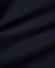 Men's Grover Pique Longsleeve Polo in a deep, luxurious navy blue, showcasing the premium, breathable pique fabric texture with subtle, elegant drapes, perfect for refined streetwear. (6)