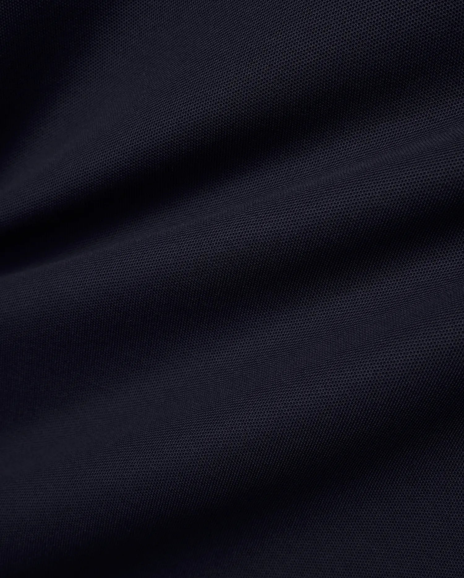 Men's Grover Pique Longsleeve Polo in a deep, luxurious navy blue, showcasing the premium, breathable pique fabric texture with subtle, elegant drapes, perfect for refined streetwear. (6)