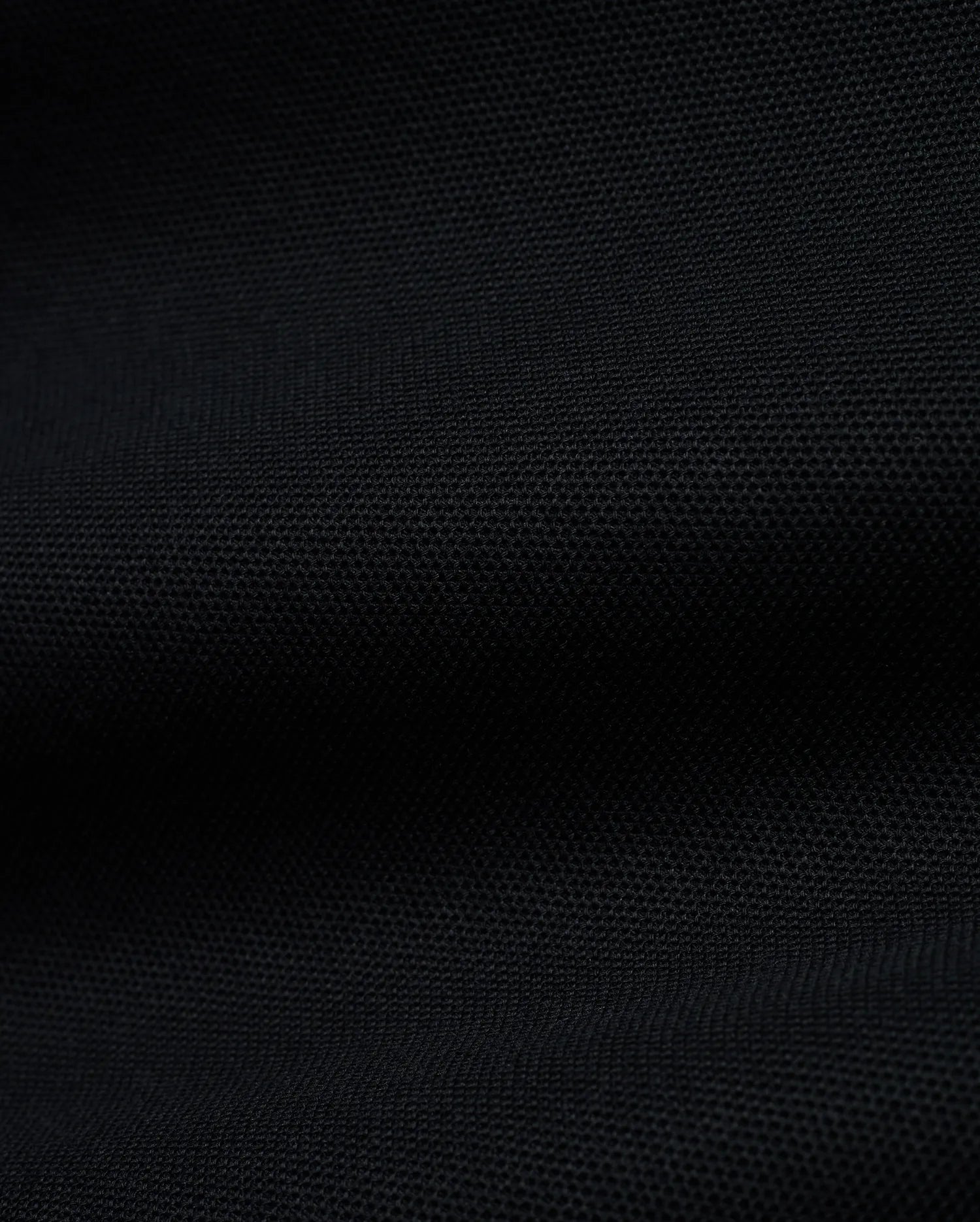 Men's Grover Pique Longsleeve Polo in rich black, showcasing its premium, finely textured pique knit fabric, a versatile and comfortable staple for sophisticated streetwear. (6)