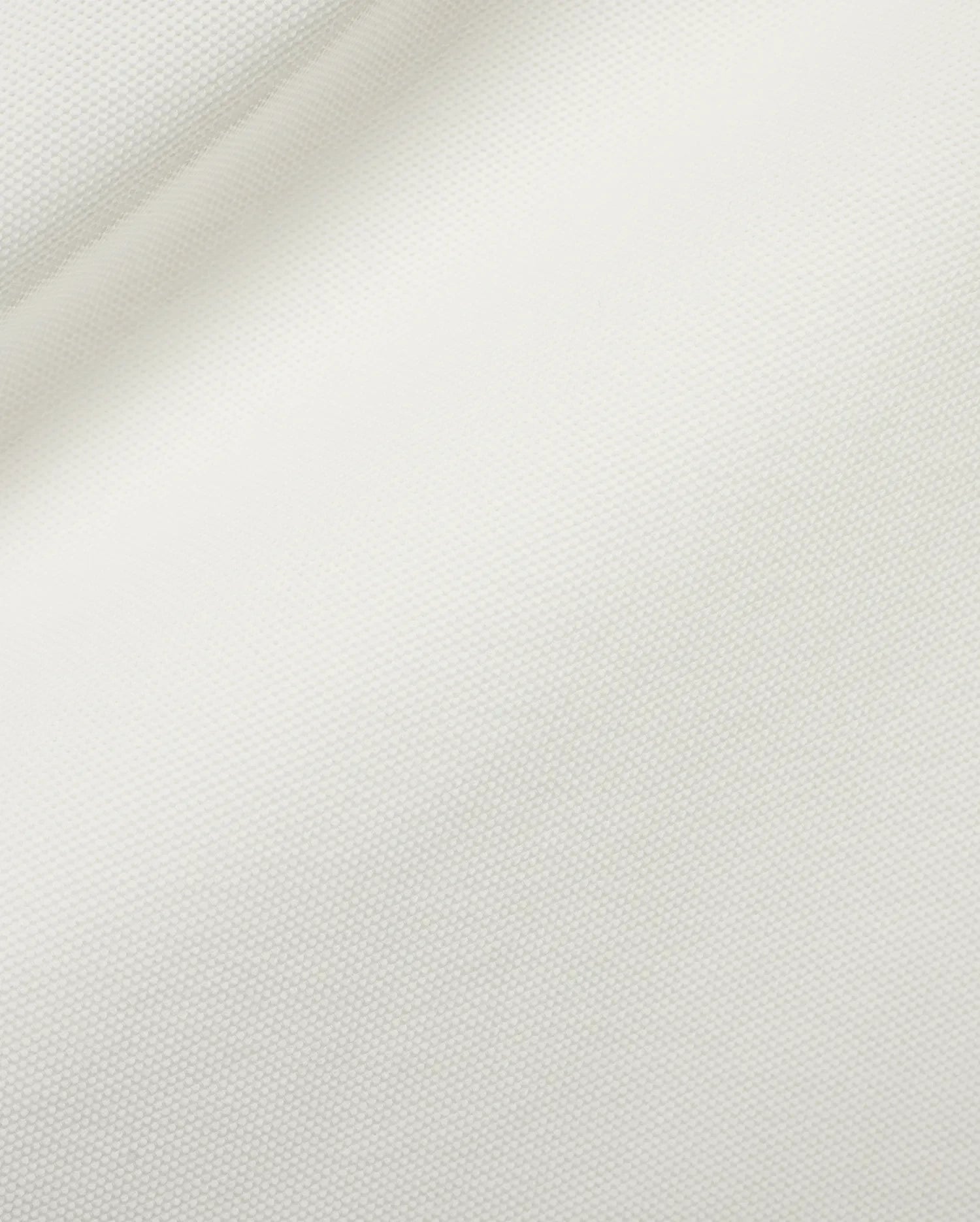 Men's Grover Pique Longsleeve Polo in a pristine white hue, highlighting the distinctive, breathable, and finely textured pique knit fabric, ideal for refined streetwear. (6)