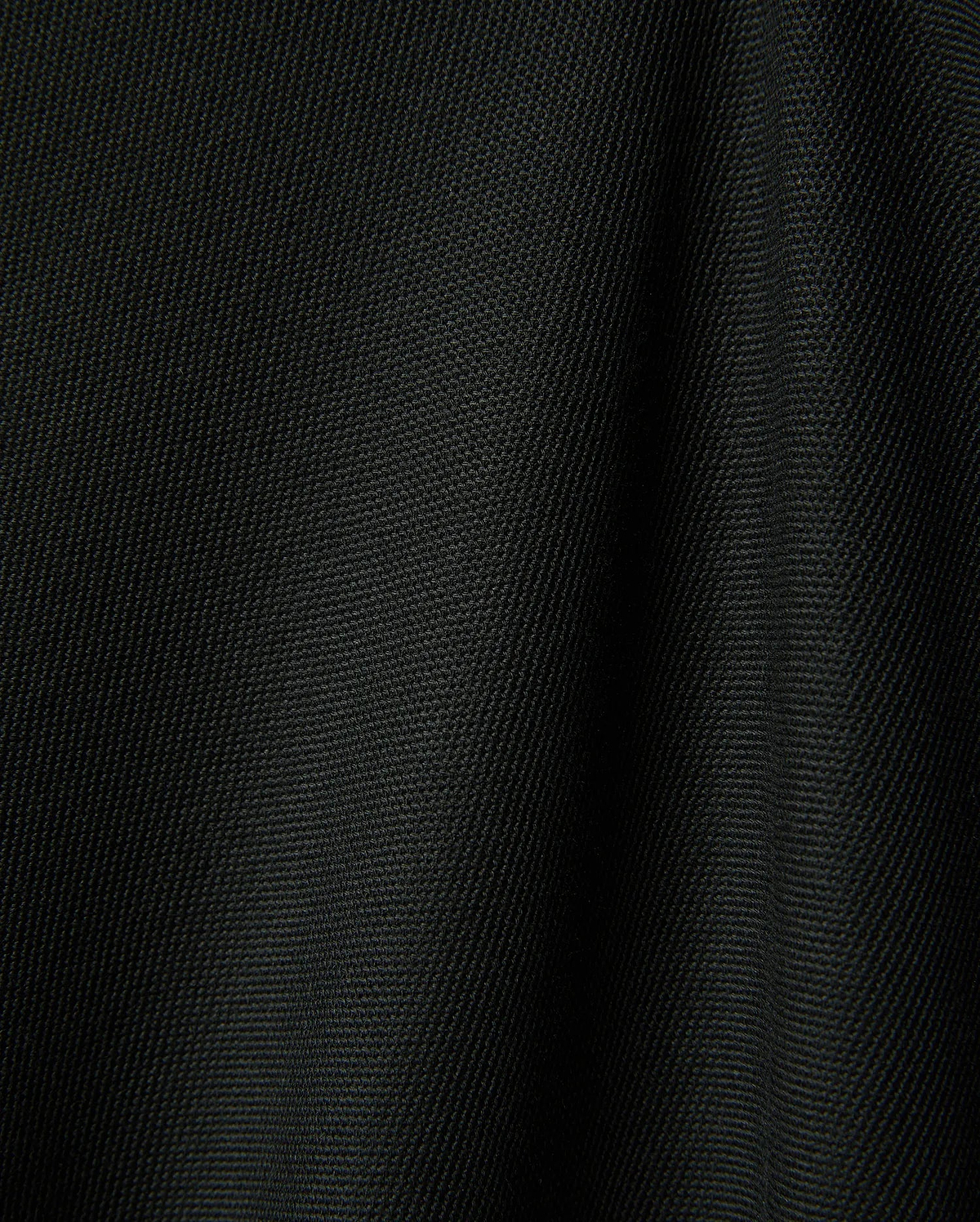 Black Mens Ringston Pique Polo, showcasing its classic pique knit texture, featuring the iconic embroidered Psycho Bunny skull logo on the left chest.