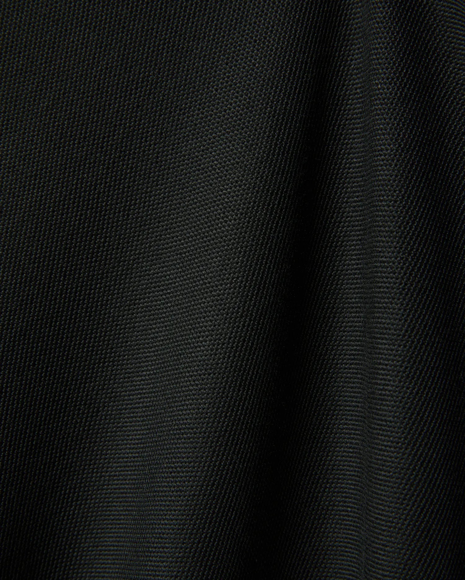 Black Mens Ringston Pique Polo, showcasing its classic pique knit texture, featuring the iconic embroidered Psycho Bunny skull logo on the left chest.