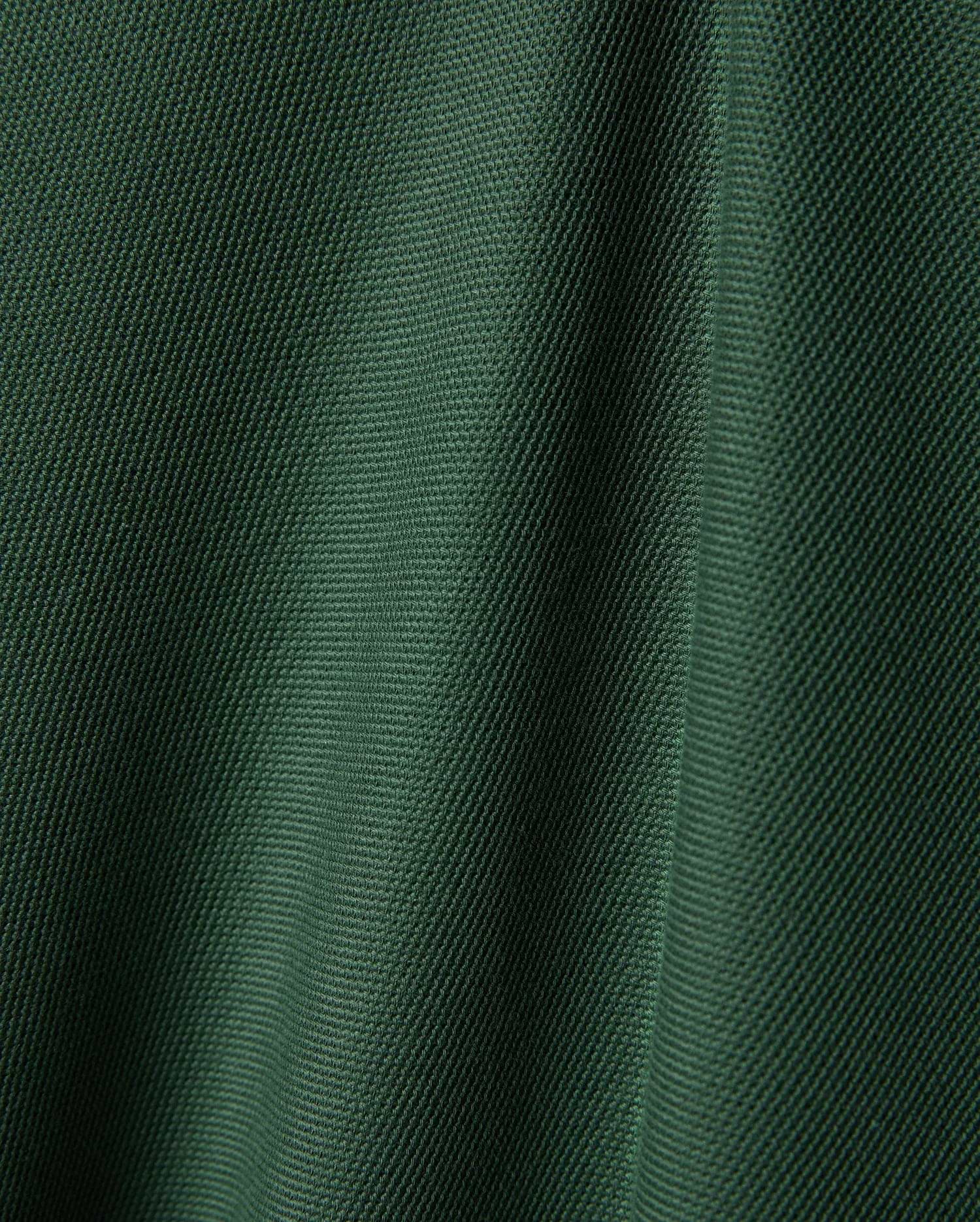 Psycho Bunny Mens Ringston Pique Polo, a premium refined streetwear piece in a rich, deep forest green, highlighting its classic, breathable pique knit texture.